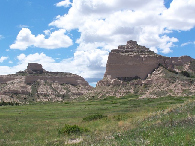 A gap between two distinctive sandstone bluffs.