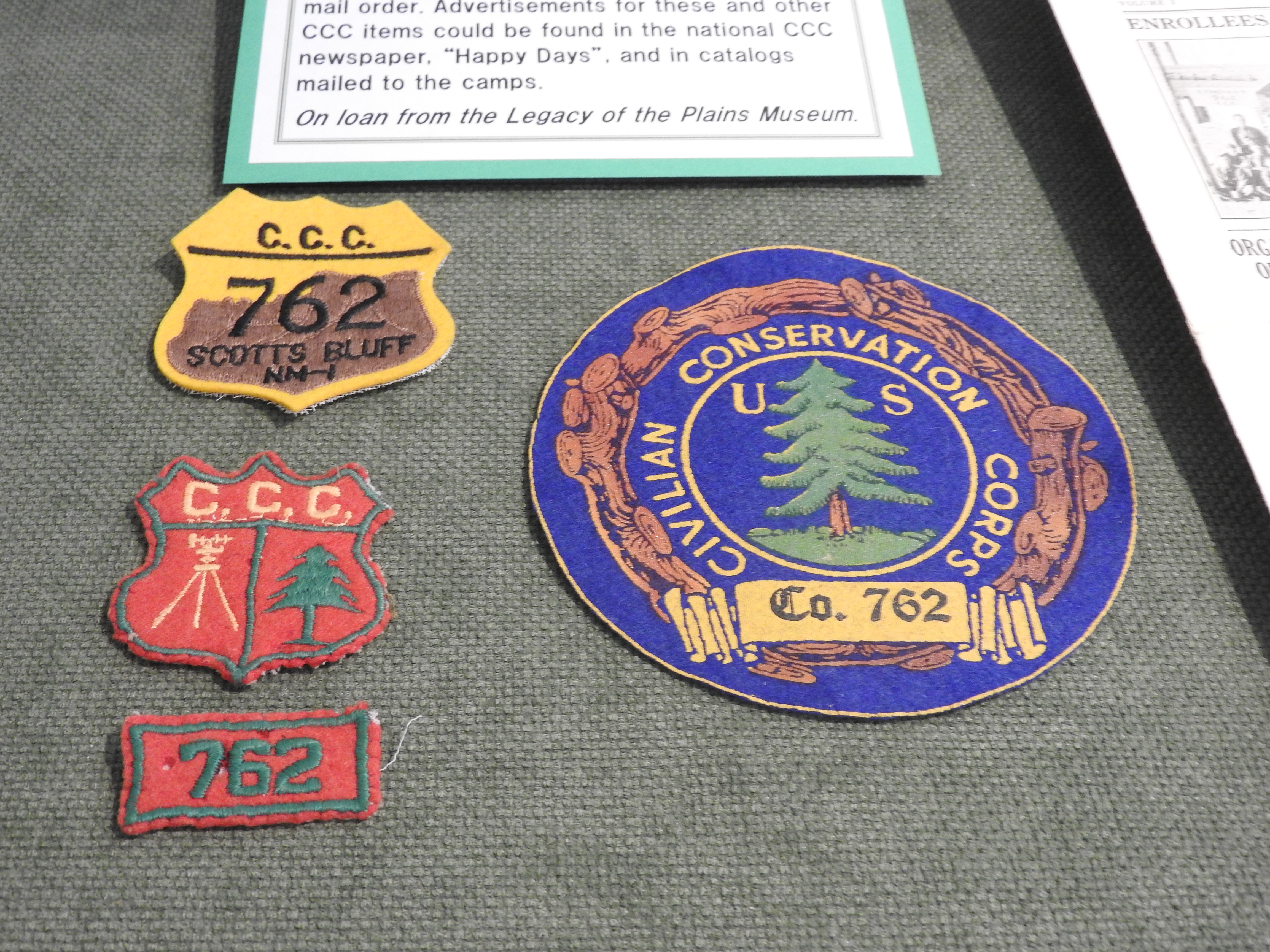 A cluster of four colorful patches. All are identified with the Civilian Conservation Corps.