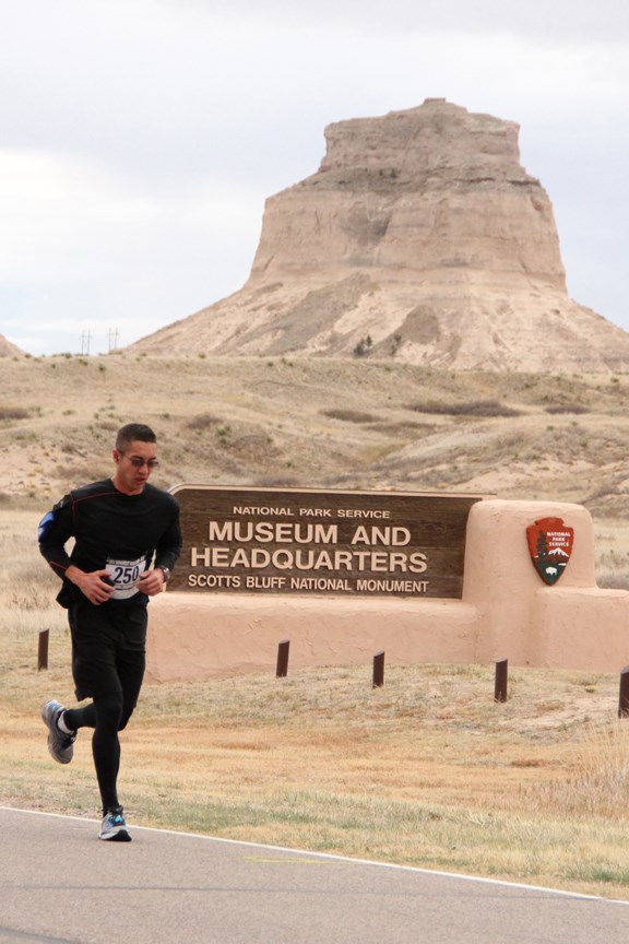 Marathon runner passing Dome Rock