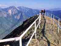 Railings stretch out along either side of the Moro Rock overlook surrounded by the canyon of the Middle Fork of the Kaweah River Railings stretch out along either side of the Moro Rock overlook surrounded by the canyon of the Middle Fork of the Kaweah River