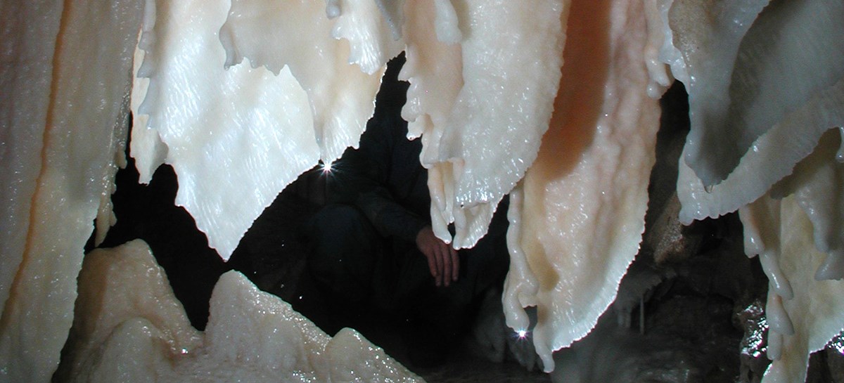 Cave formations with an orange tinge Cave formations with an orange tinge