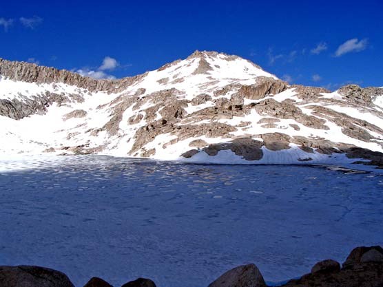 Frozen Columbine Lake with Sawtooth Mountain behind it Frozen Columbine Lake with Sawtooth Mountain behind it