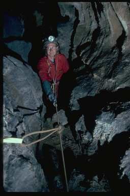 Joel Despain at the top of the rope leading to Betelgeuse Balcony in Hurricane Crawl Cave