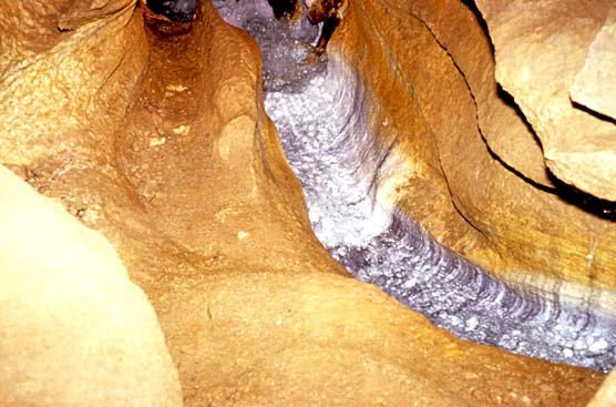 Cave stream with layers of erosion clearly visible