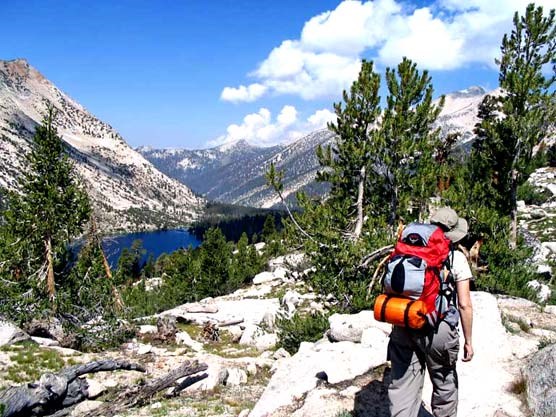 Hiker on John Muir/Pacific Crest Trail above Charlotte Lake in Kings Canyon National Park Hiker on John Muir/Pacific Crest Trail above Charlotte Lake in Kings Canyon National Park