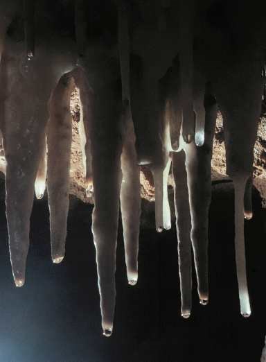 Water drops hang from a soda straw formation in Crystal Cave in Sequoia National Park
