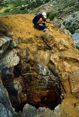 Person next to a mine shaft along Franklin Creek in Sequoia National Park