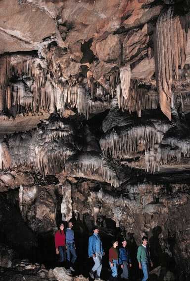 Tourists enjoy the views in Marble Hall, the largest room in Crystal Cave