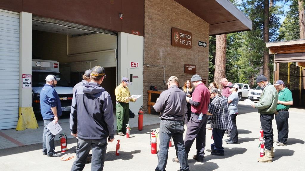 Participants follow along as Captain Greg Ver explains the types of fire extinguishers