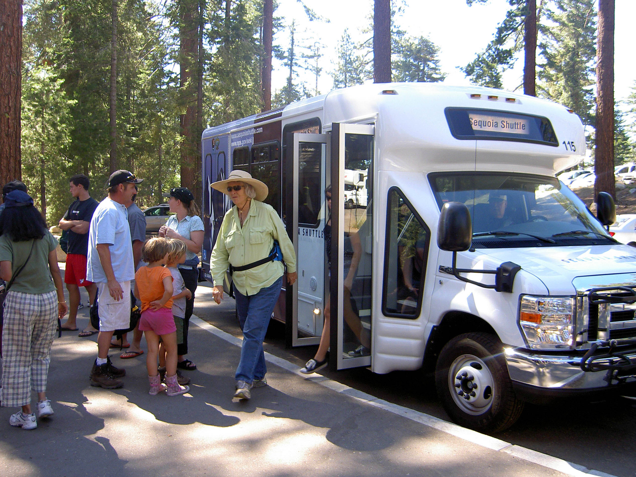 Park visitors using the shuttle service in the Giant Forest