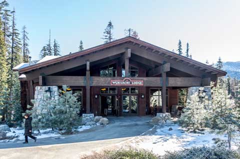 The entrance of Wuksachi Lodge with light snow on the ground