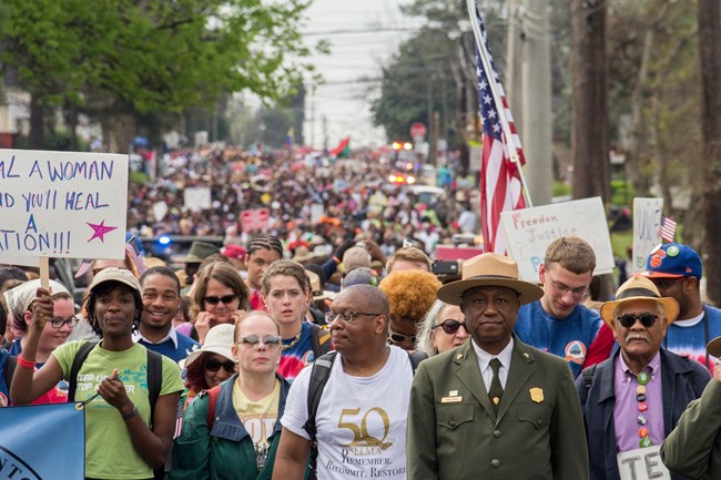 NPS Ranger with group of marchers at SEMO commemorative march in 2015