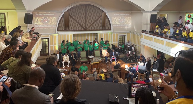 View from the balcony of a crowded church.