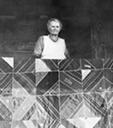 Emma Susan Weakley on the porch of the family homestead at Big Meadows (ca 1920). Emma Susan Weakley on the porch of the family homestead at Big Meadows (ca 1920).