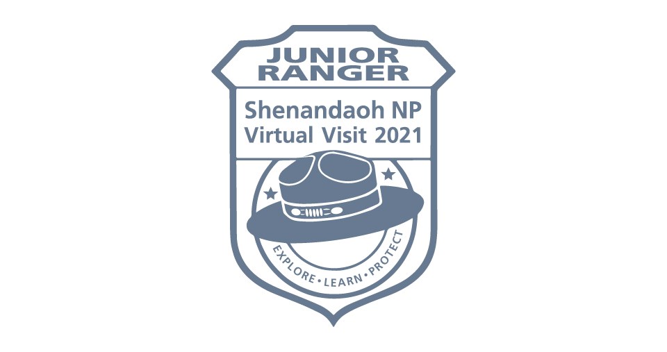 SHEN_JRRanger_Badge A logo of an arrowhead with the words Shenandoah National Park Virtual Junior Ranger in the middle of it