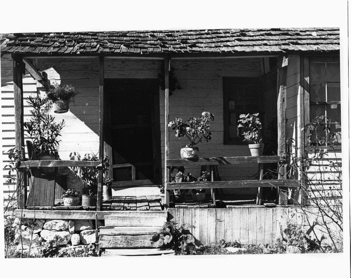 Historic photo of homestead front porch.