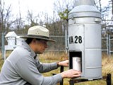 Park staff maintaining air quality monitoring instruments.