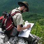 Eric Butler taking notes on park geology. Eric Butler taking notes on park geology.
