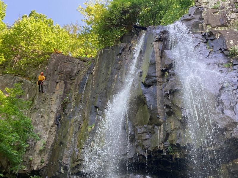 A Search and Rescue Ranger repels from a waterfall.