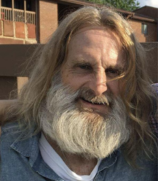 66-year-old male. 5'7" 125 lb. Gray beard.