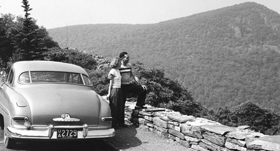 A couple pausing to take in a scenic view from Skyline Drive.