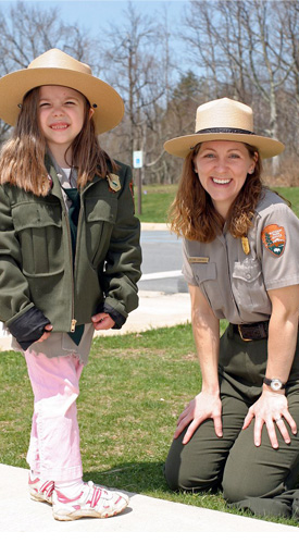 A ranger and a young visitor dressed up like a ranger at National Junior Ranger Day in Shenandoah. A ranger and a young visitor dressed up like a ranger at National Junior Ranger Day in Shenandoah.