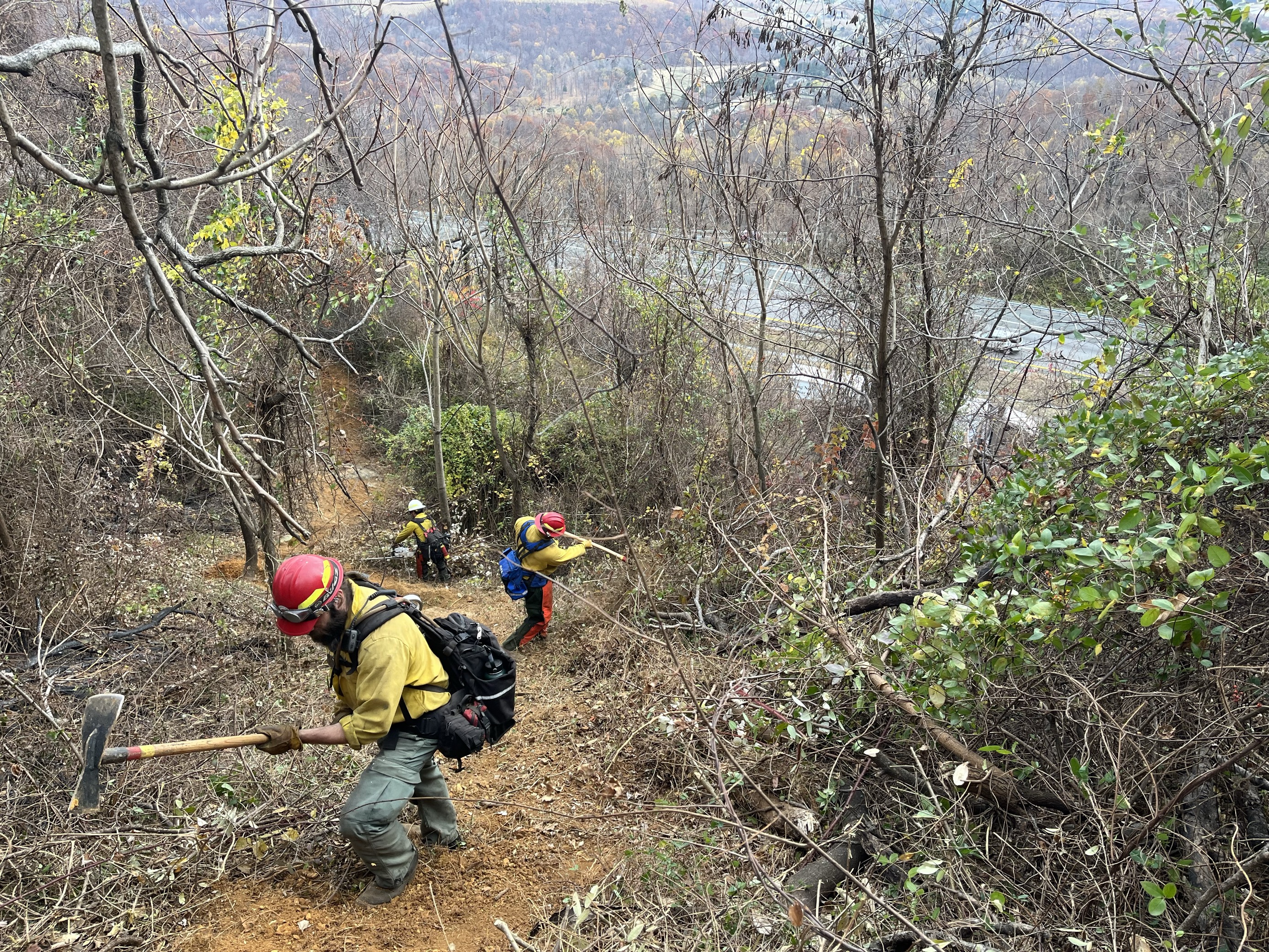 Firefighters on steep terrain