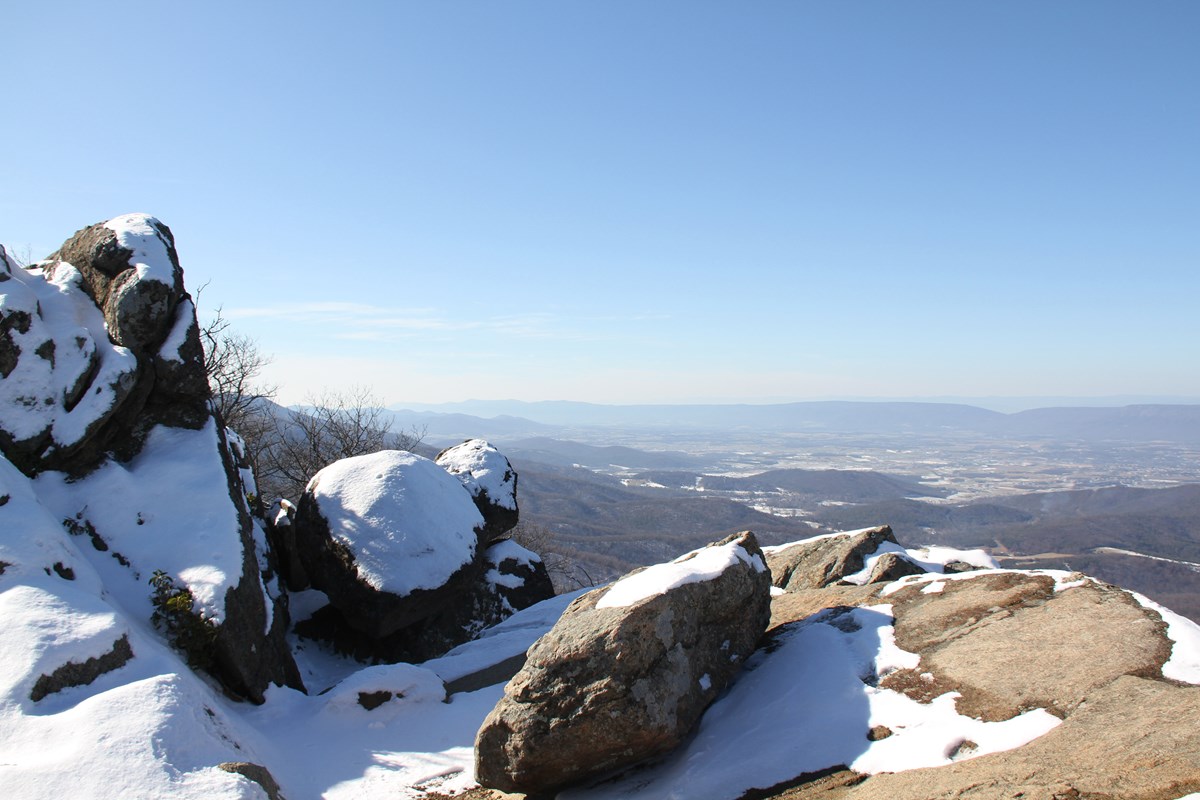 Marys Rock in Winter A view over a rocky mountaintop with snow and a clear sky.