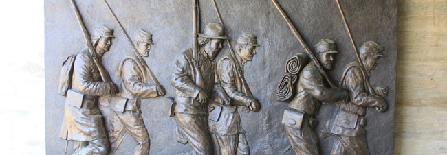 Sculpture of marching soldiers at Corinth Civil War Interpretive Center Sculpture of marching soldiers at Corinth Civil War Interpretive Center