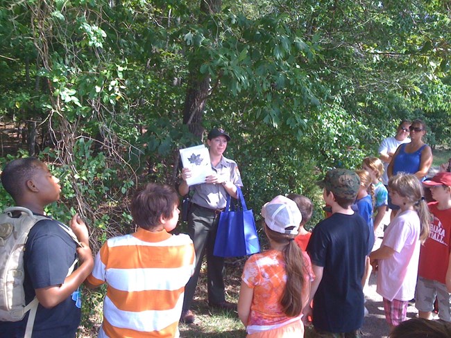 Children learning from a park ranger