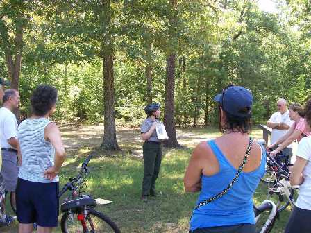 A ranger leading a bicycle tour