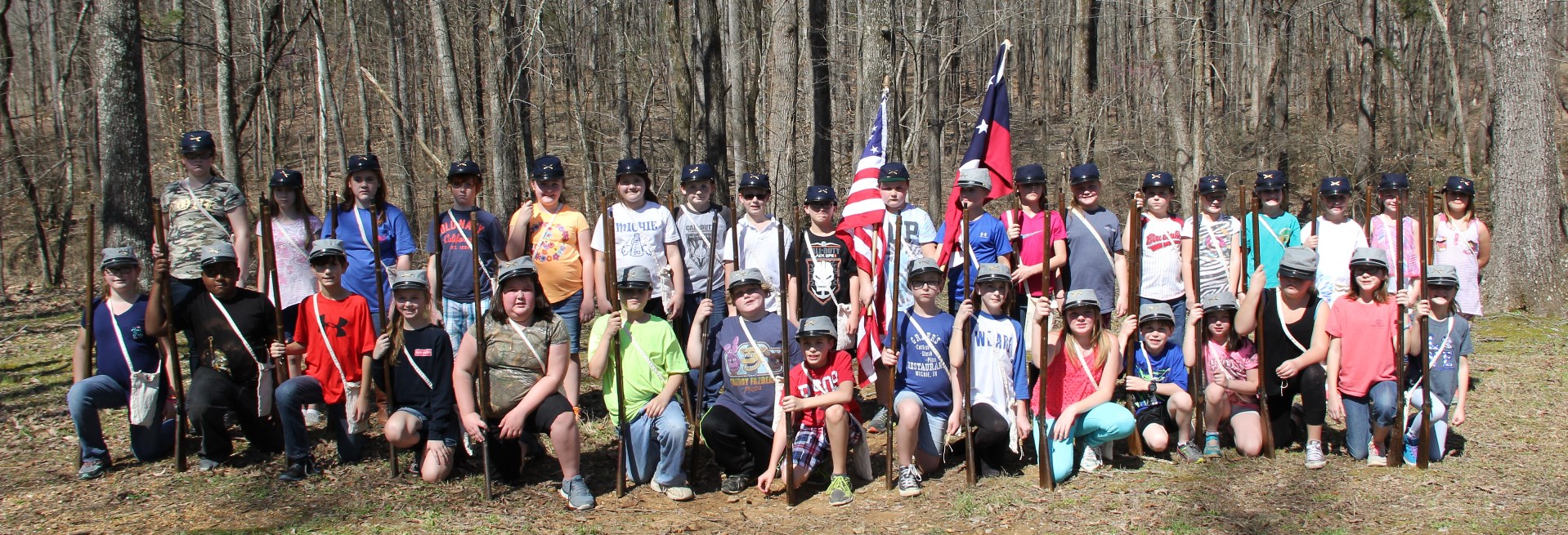camp of instruction EKIP Children pose with toy muskets