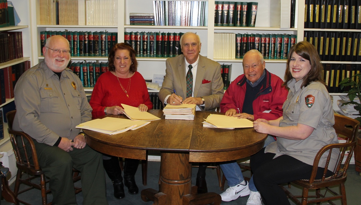Signing the Documents NPS staff and friends group sign the documents to transfer the land
