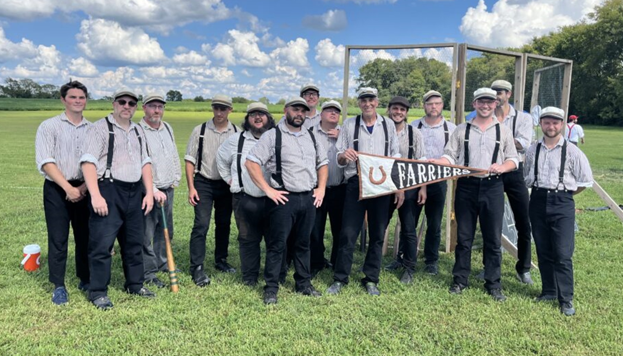 franklin farriers Men in period base ball uniforms post with their pennant.