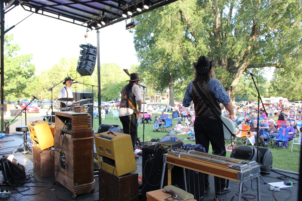 Richie Owens onstage performing for a large crowd