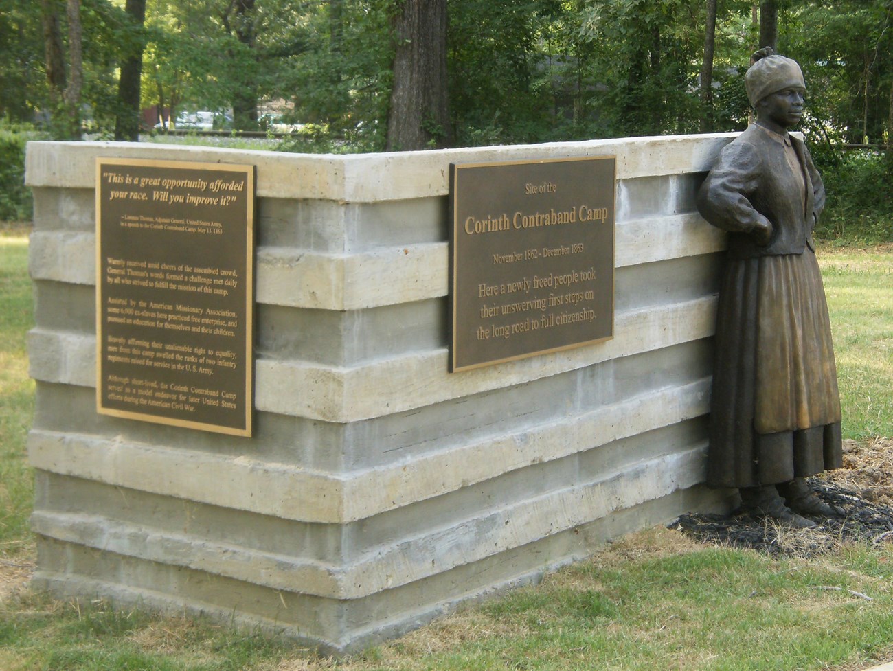 Bronze statue of woman at the Corinth Contraband Camp entrance