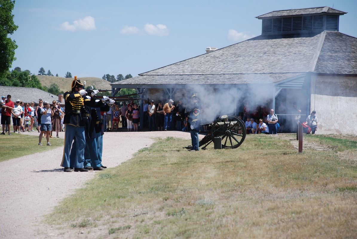 Rifle salute on Fourth of July with artillery.
