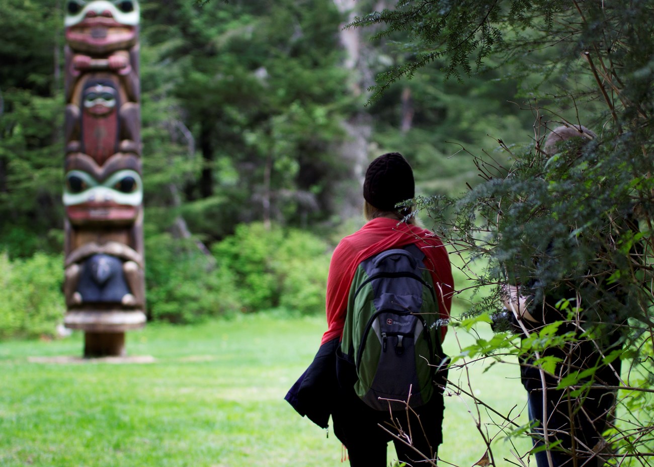 Women looking at Totem Pole