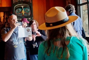 Parents taking a photo of a junior ranger. Parents taking a photo of a junior ranger.