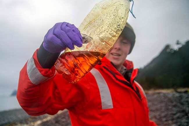 Closeup of a plastic water bottle collected during a beach clean up.