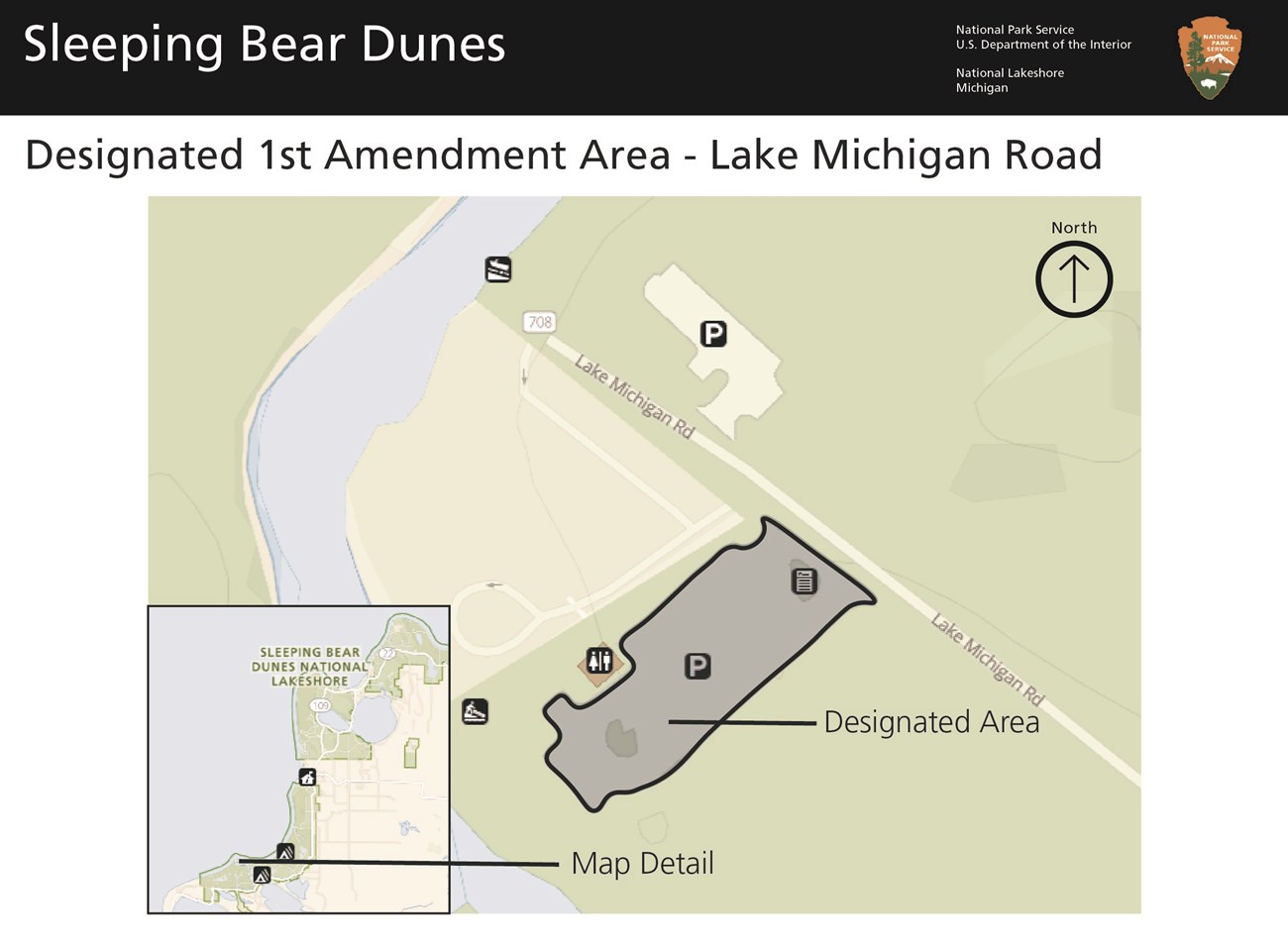 A map of the terminus of Lake Michigan Road including parking lots and boat launch. A section south of the road in the south parking lot is marked in grey. This is the first amendment area. There is a smaller inset map of the park.