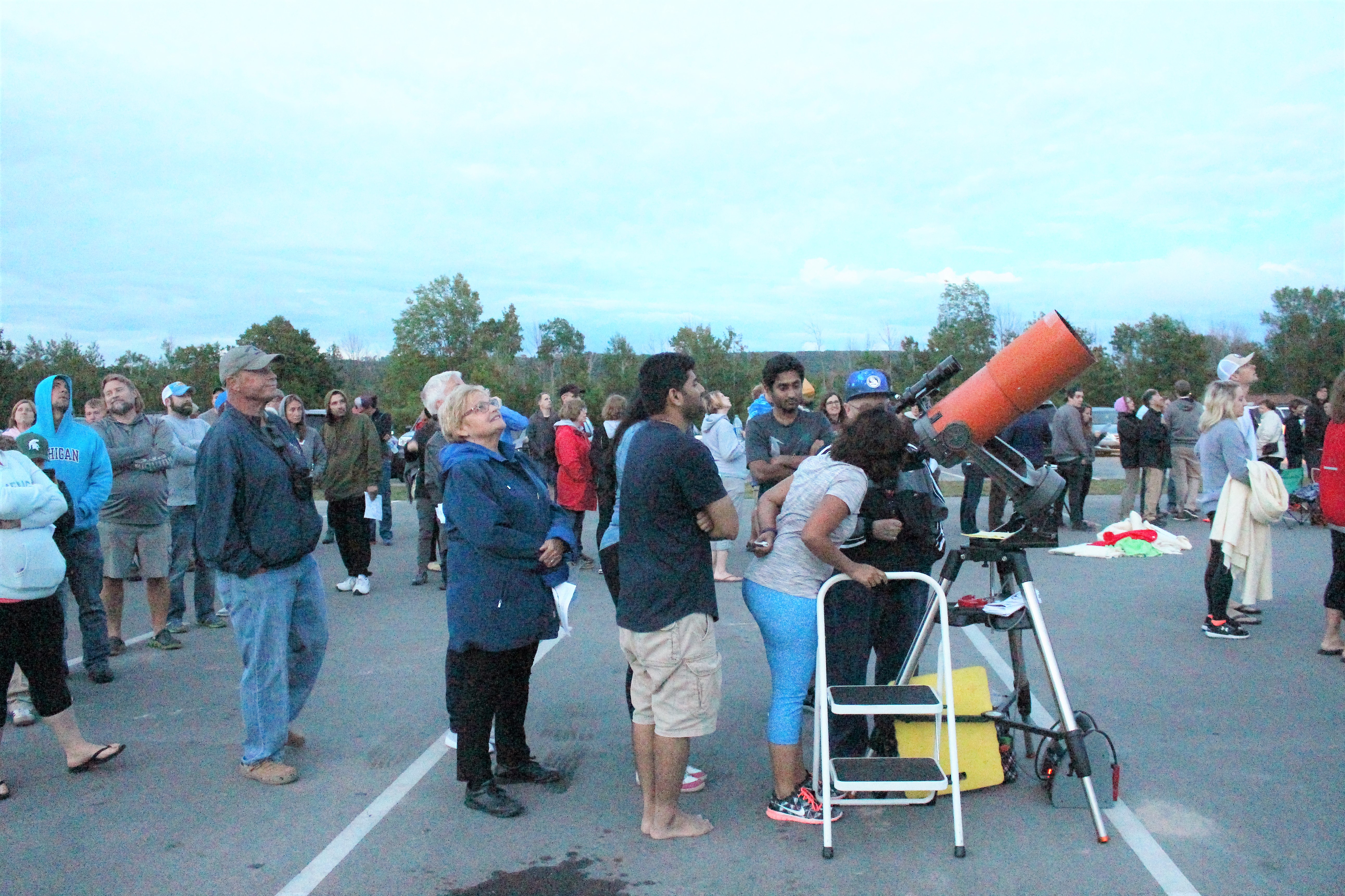Sky gazers look through large telescopes