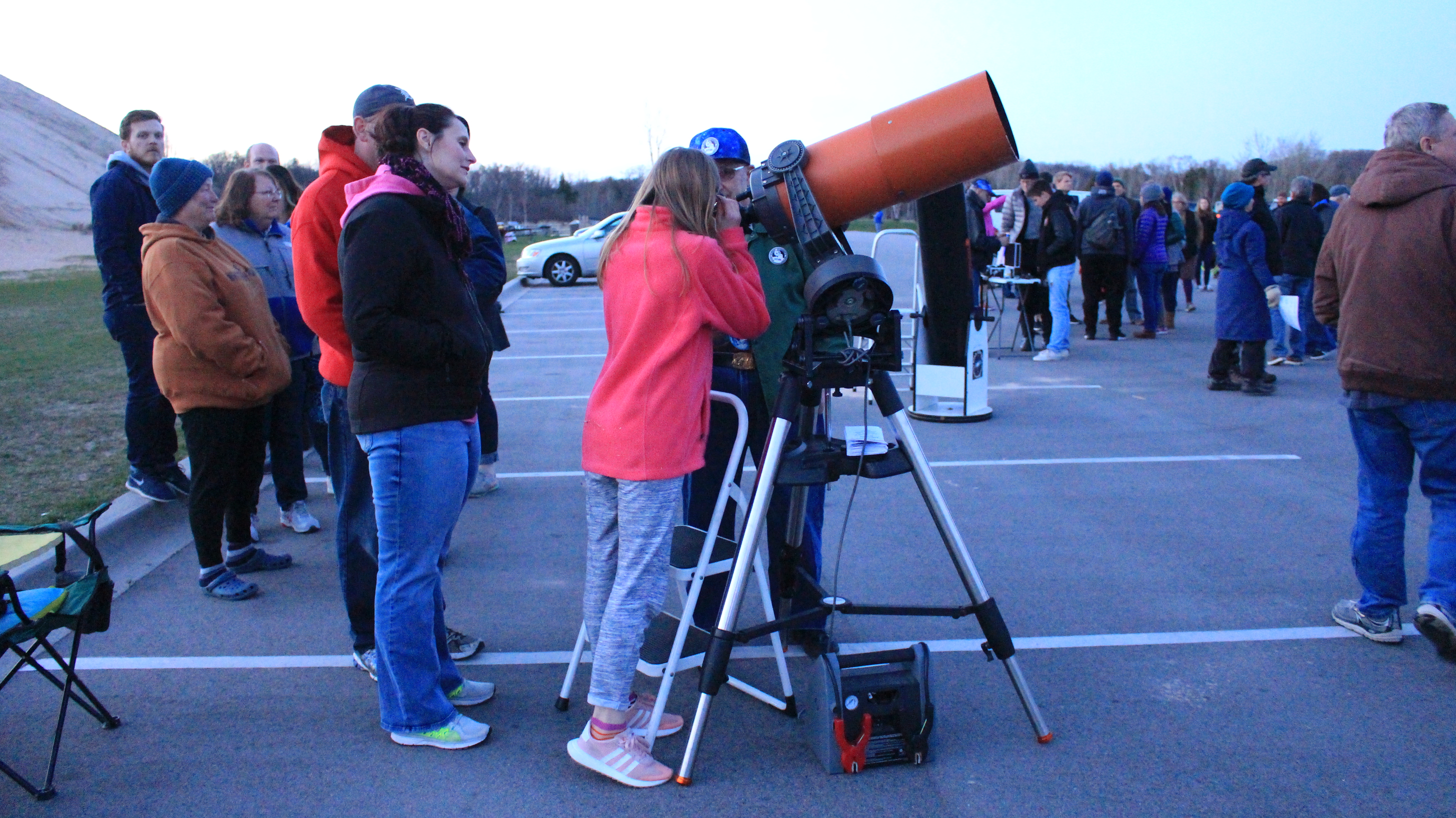 Visitors looking through large telescopes