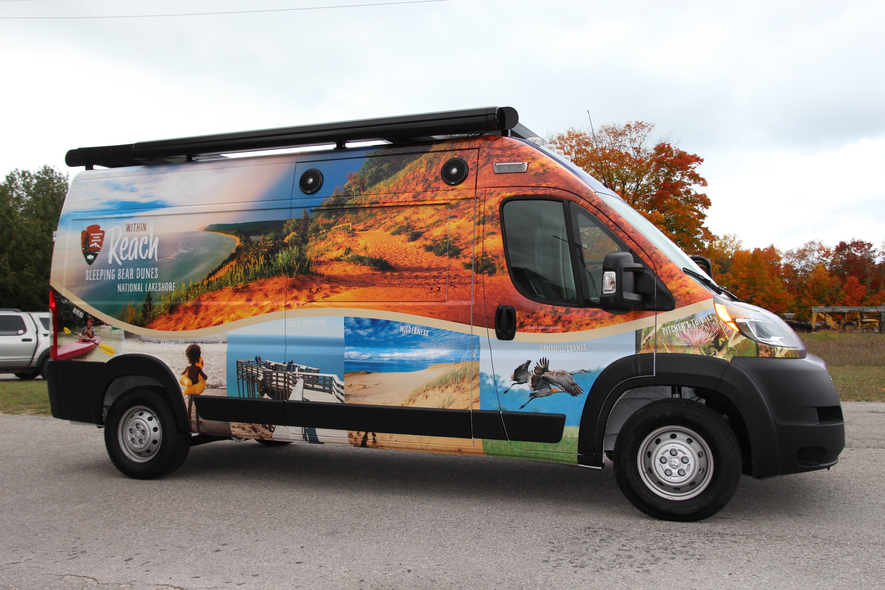 Van with photos of sites in Sleeping Bear Dunes all over it