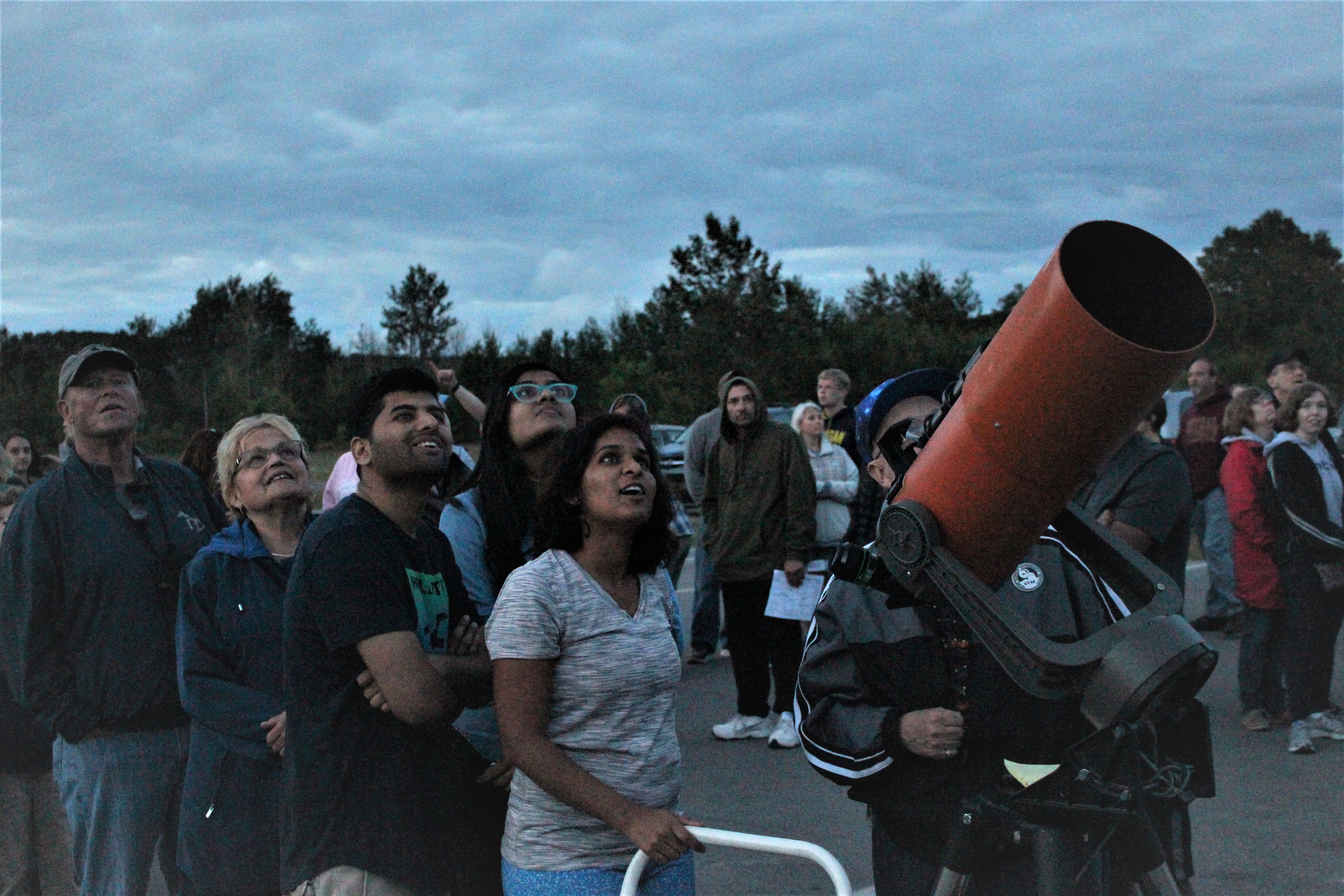 Star-Gazers-at-Dune-Climb A group of gazers look up to the stars behind a large telescope