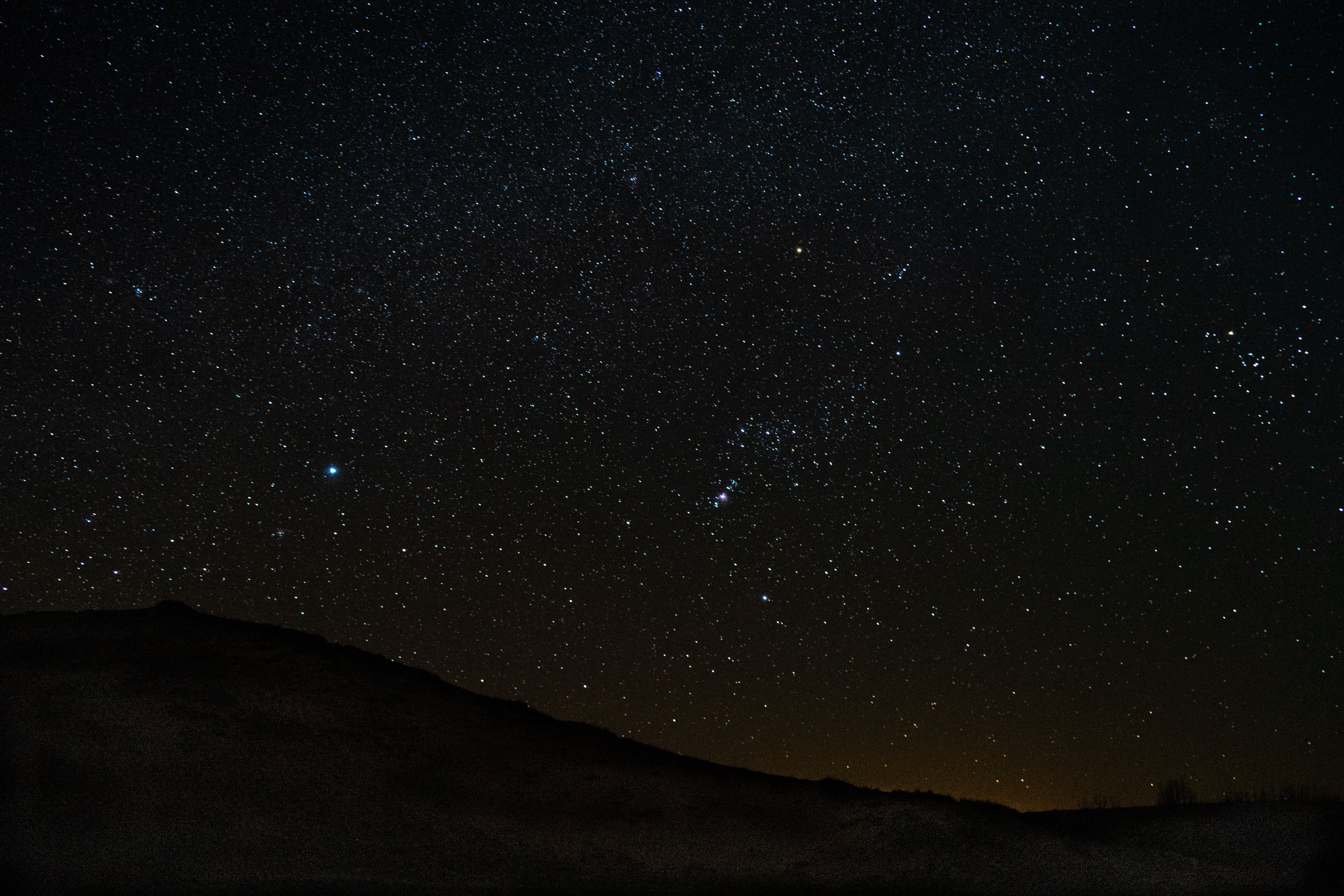 Star-Party-Clear-Skies Stars fill the dark sky over the silhouette of a dune