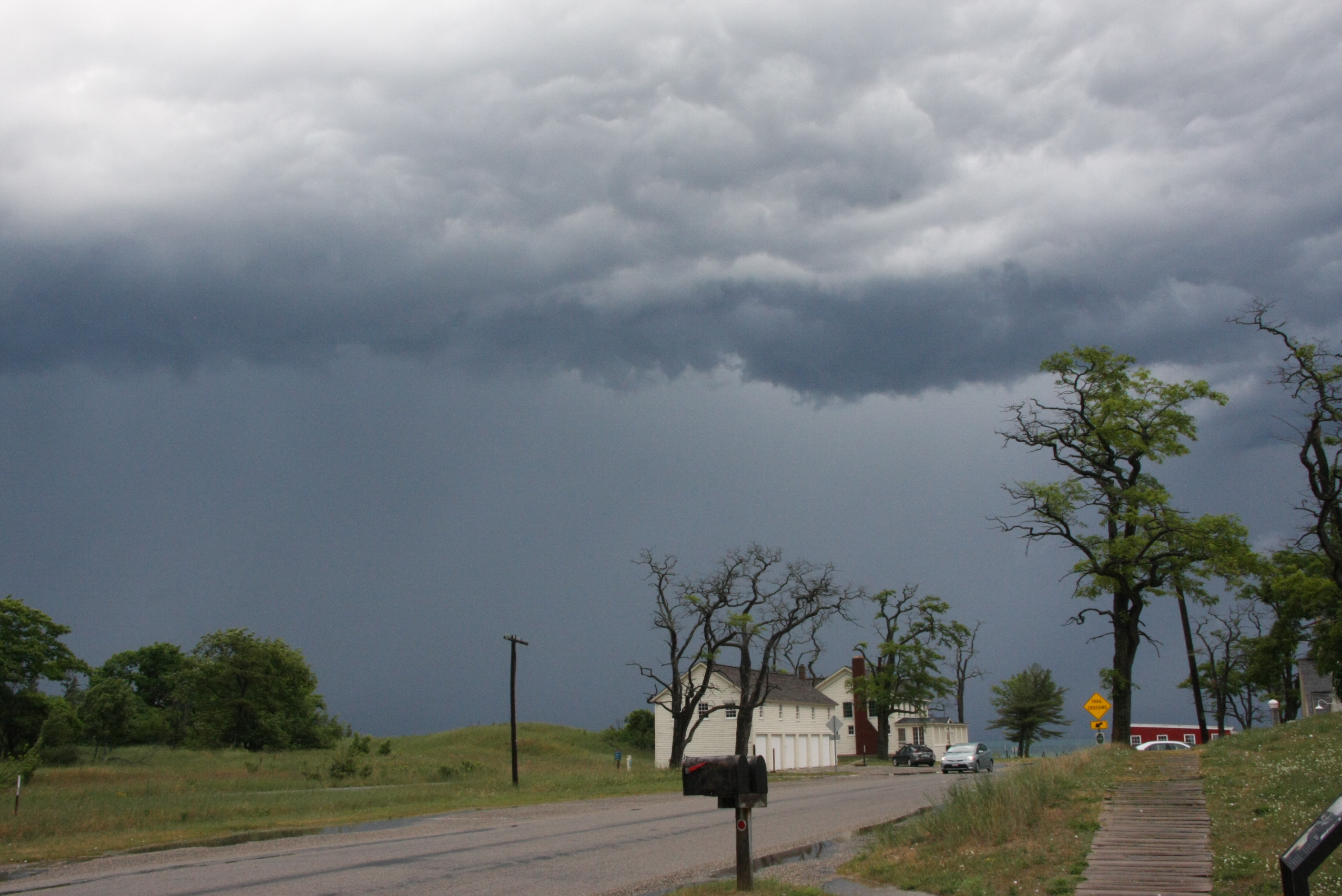 An ominous dark cloud hangs over the Sleeping Bear Inn in Glen Haven