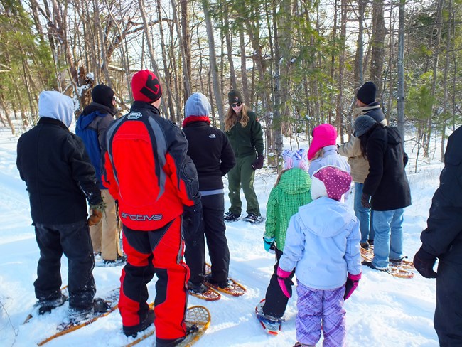 Snowshoeing visitors learn about the park in winter