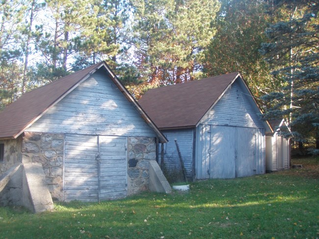 Stone garage with wooden doors