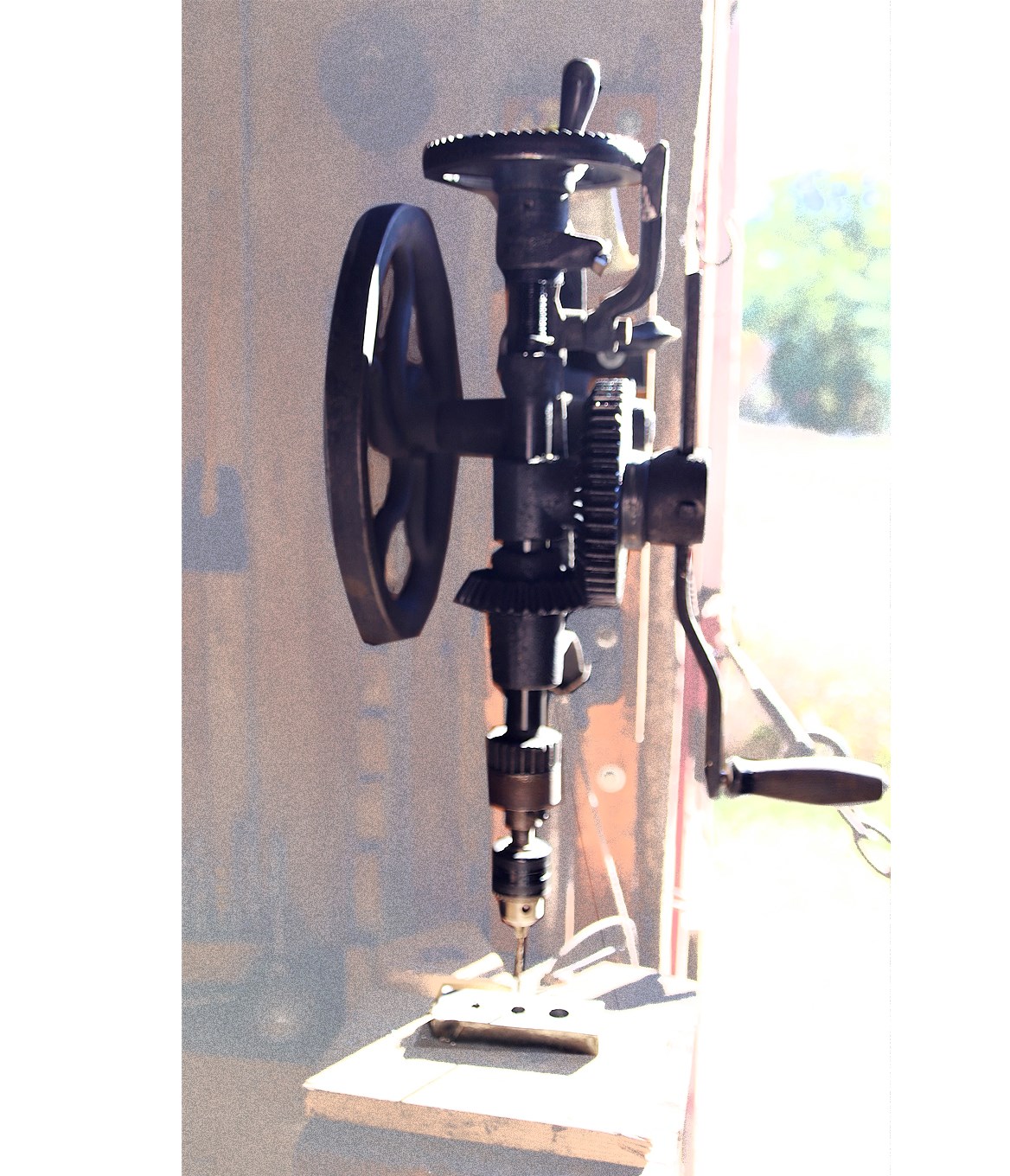 Old drill press with intricate gears